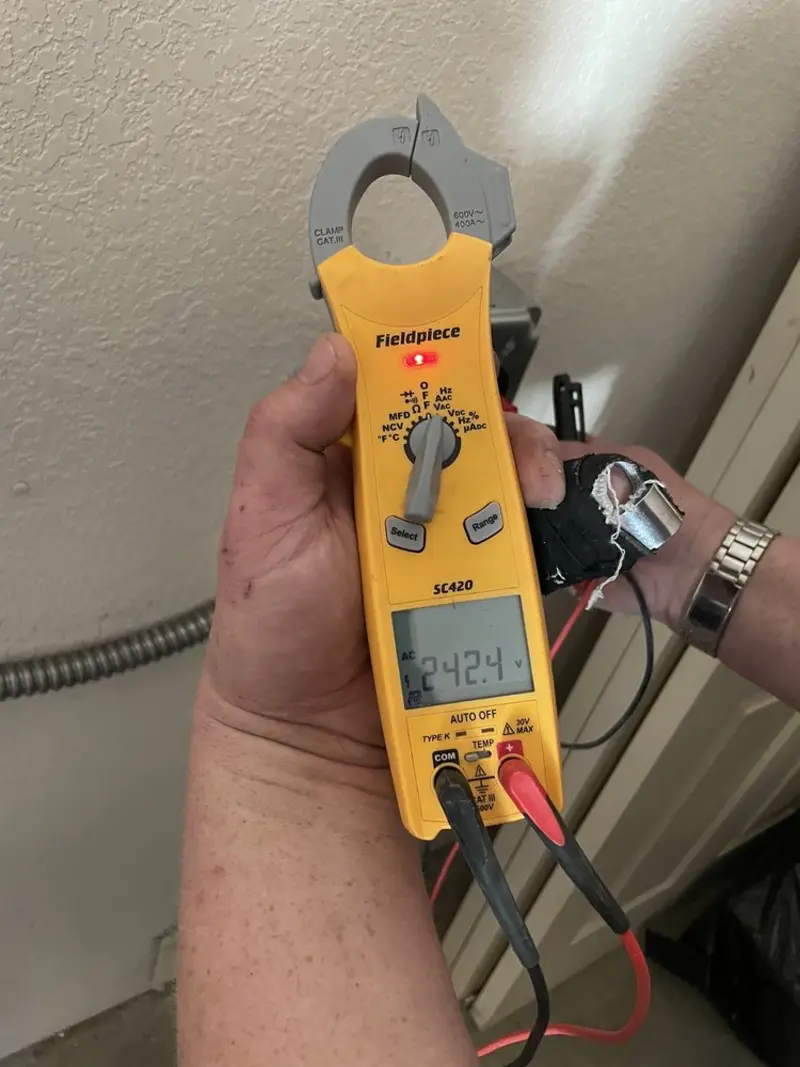 Voltage testing with clamp meter during Electrical Installation Services in Albuquerque